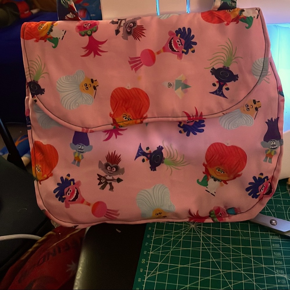 Disney Trolls mini messenger bag for preteens, teenagers, has a inside pocket